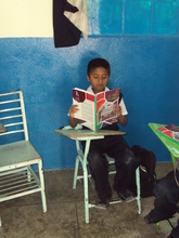 Boy reading "I want to, I can" book