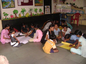 Lakshmi engaged in group study