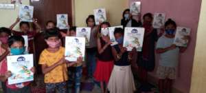 Children are excited to receive the workbooks
