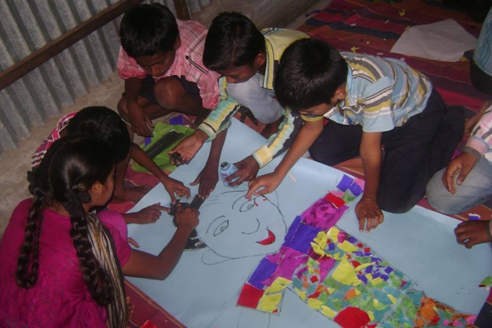 kids creating a colourful collage.