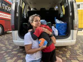 Mother comforts a child after a long road from the