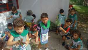 Working in the community kinderarden's orchard