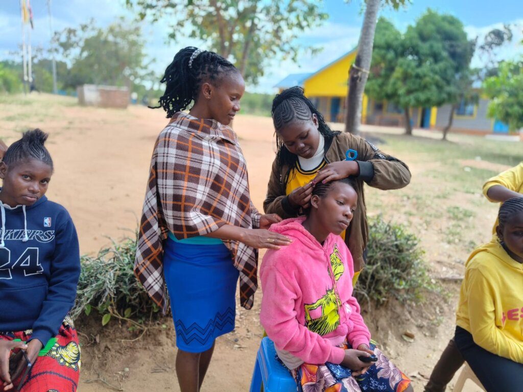 Esther demonstrates her skills to current students