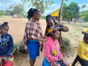 Esther demonstrates her skills to current students