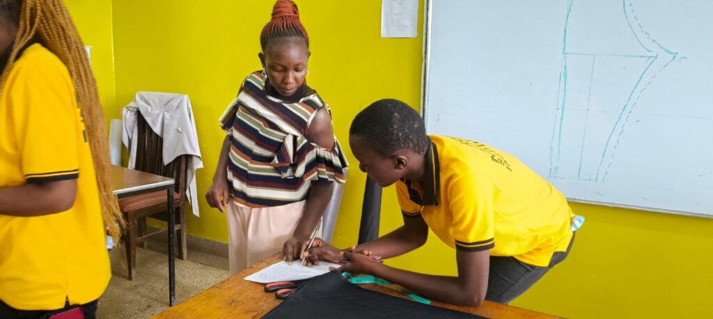 Rhoda teaching her Seed of Hope Fashion class