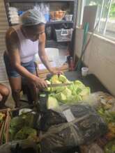 Preparing fresh vegetables for community meals