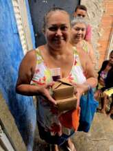 Community member receiving freshly prepared meals