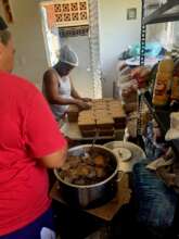 Volunteers preparing meals in the community kitche