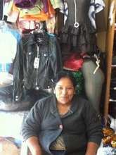 Angela in front of her shop.