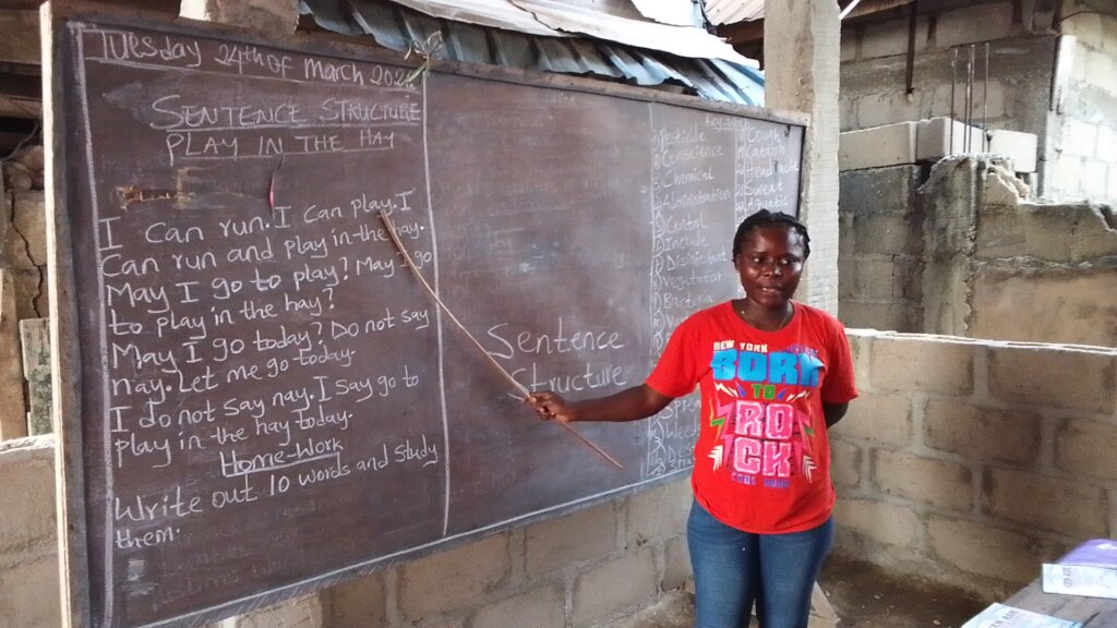 Volunteer (teacher) teaching children new words