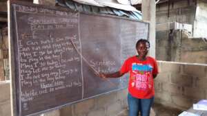 Volunteer (teacher) teaching children new words