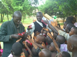 Children welcoming bisuits at the orphanage