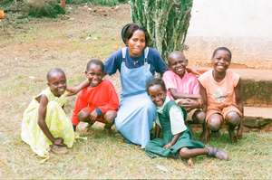Teacher Lydia and the orphans after Lunch.