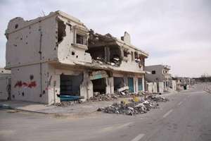 A heavily damaged home in the town of Sirte.