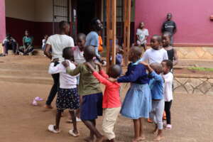 Children playing outside the Welcoming House