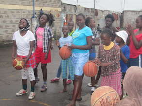 Girls learning basketball skills during the camps