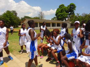 Pep talk before basketball scholarship tryouts
