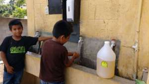 Students washing their hands with Baobab soap