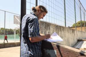 A WASH team member conducts monitoring exercises
