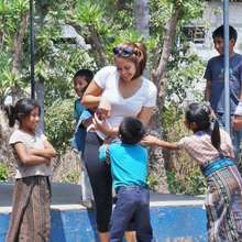 An engineer plays with students at La Cumbre