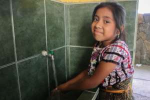 Washing up with rainwater at Patzilin Ab'aj