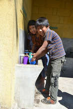 Students washing their hands