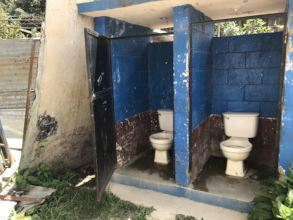 Soon-to-be replaced toilets with no seats or doors