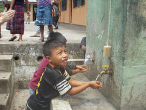 A student washes his hands in Tzanchaj