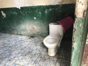 Many school toilets do not flush and have no seats