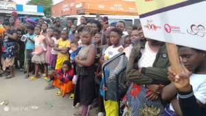 YOCUPA audience holding a sign with GRACE Cares