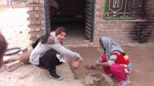 Plastering of courtyard with mud and dung