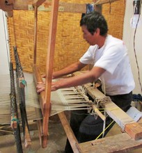 Angela's husband weaving a scarf