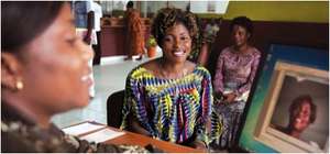 Annie Nyangomba receives a biometric ID card.