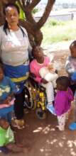 Family with a disabled child receiving food parcel