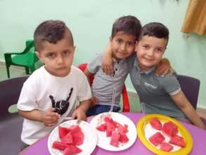 Parents bring fruits for children