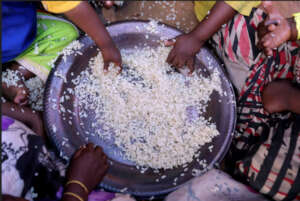 Displaced Children eat boiled rice