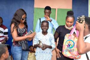 Child receiving school supplies
