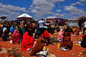 Community members gathering to receive food assist