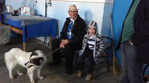 Grand Dad and his grandson bring in the family dog