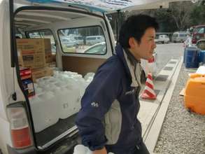 Unloading fresh water for evacuees in NE Japan