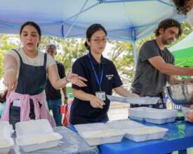 Peace Winds staff distribute hot meals