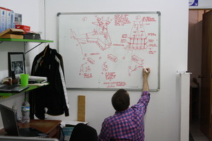 Jakub drawing a sketch of the island