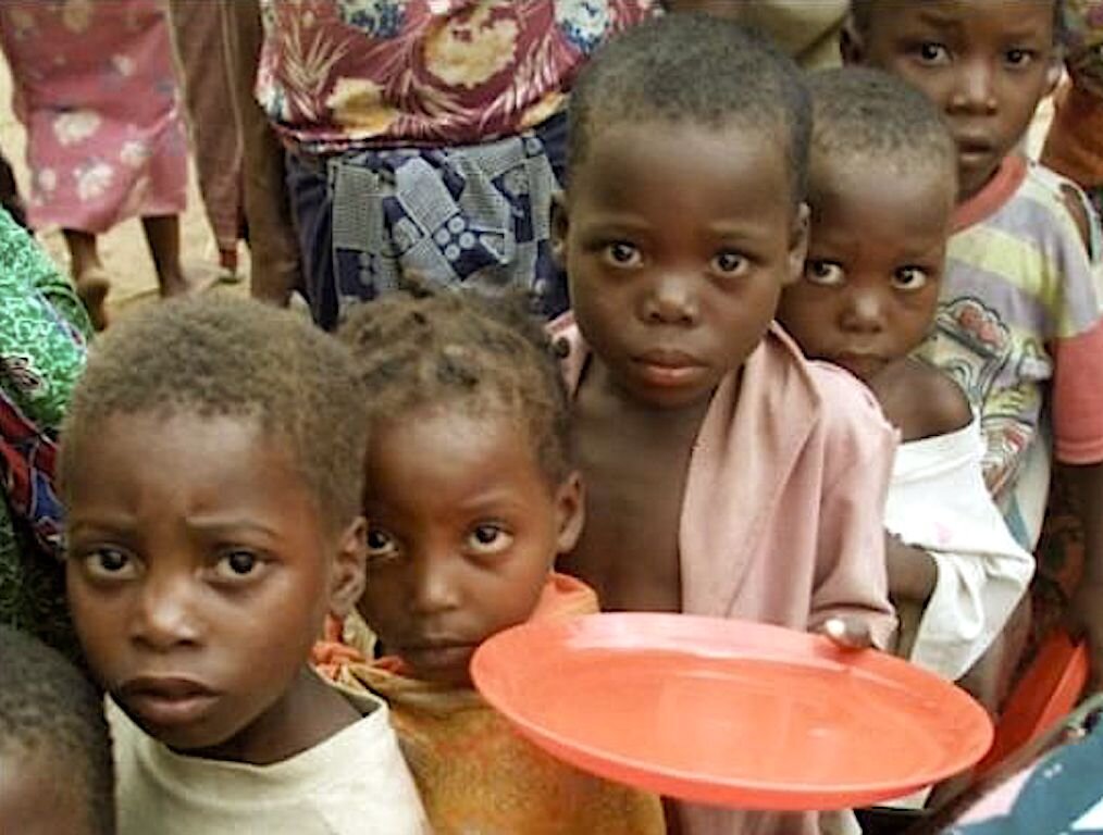 Hungry northern children line up for daily food