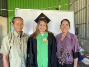 Graduate Channy with her parents.