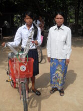Sary and mom in 2010 - a bike to get to school
