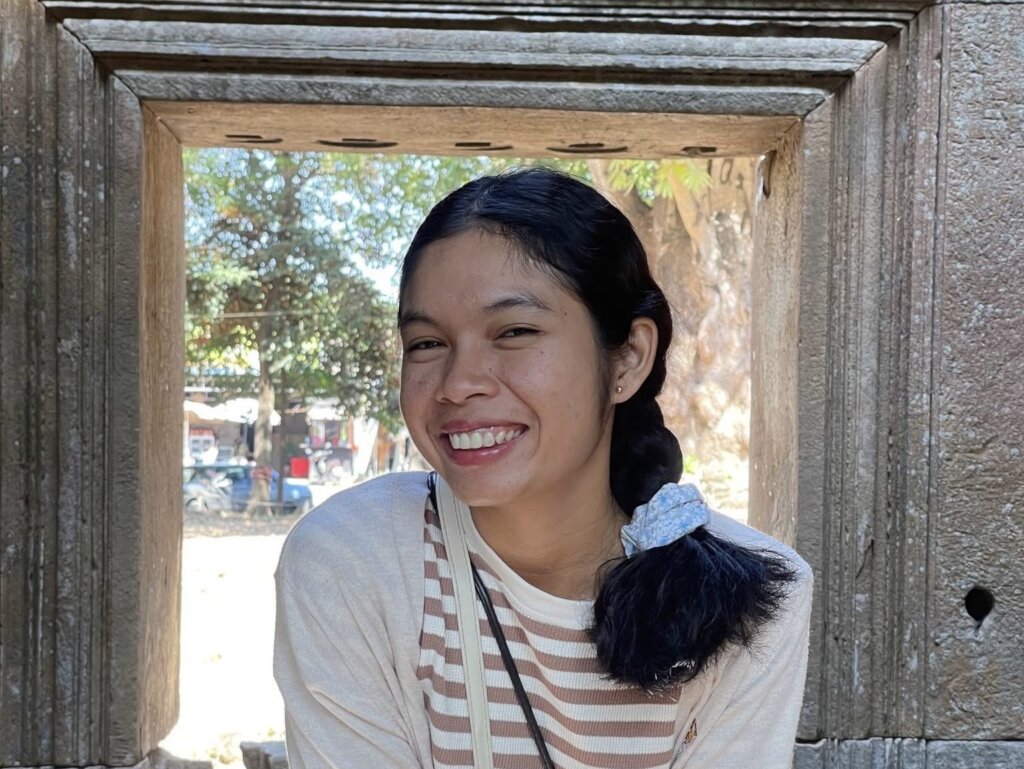 Somchhai smiling at Angkor Wat temple