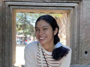 Somchhai smiling at Angkor Wat temple