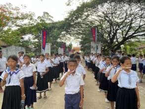 Students practice proper tooth brushing.