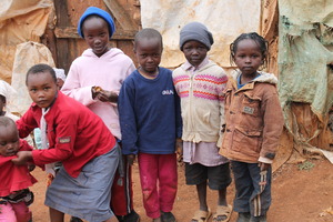 Community kids outside their homes