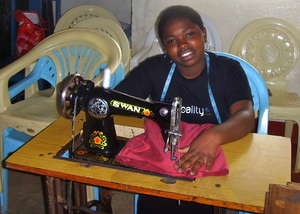 One of 8 Tailoring Trainees